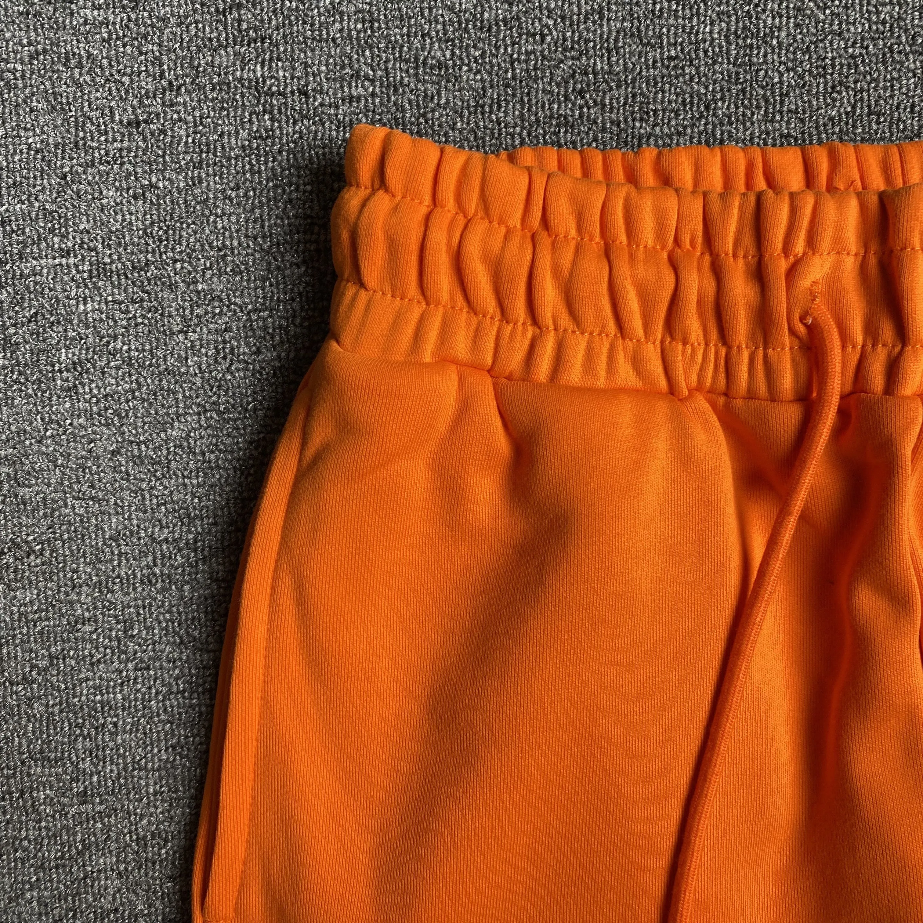DENIM TEARS COTTON WREATH SWEATPANTS ORANGE