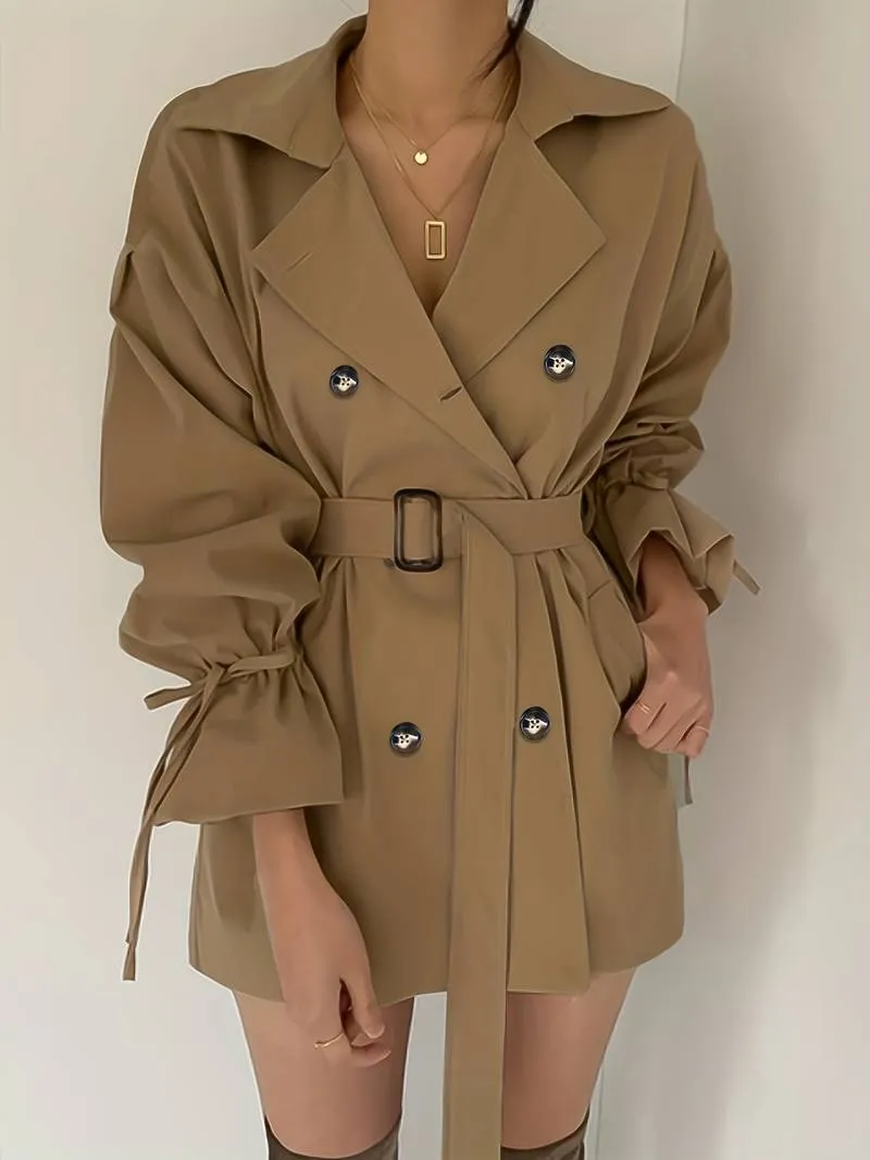 Mid-length, double-breasted trench coat with collar and belt - High-quality craftsmanship for durability - Perfect for chilly days