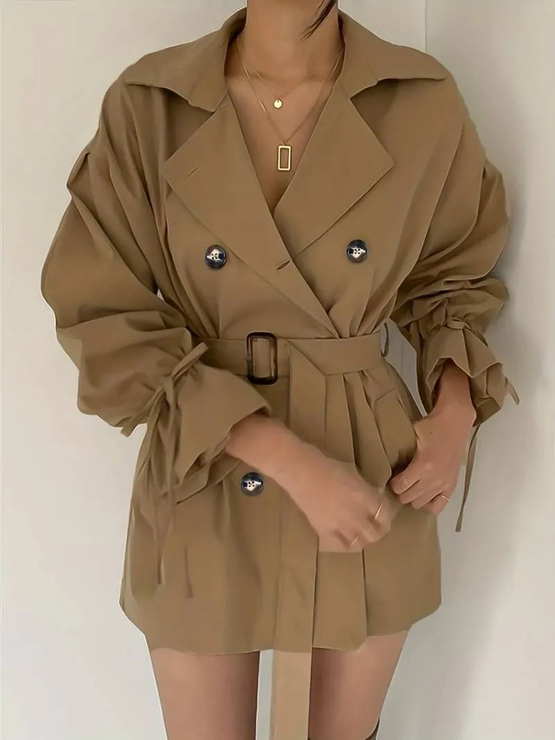 Mid-length, double-breasted trench coat with collar and belt - High-quality craftsmanship for durability - Perfect for chilly days