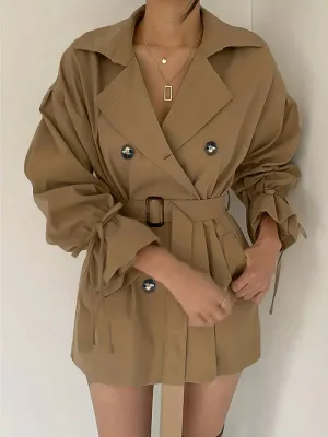 Mid-length, double-breasted trench coat with collar and belt - High-quality craftsmanship for durability - Perfect for chilly days